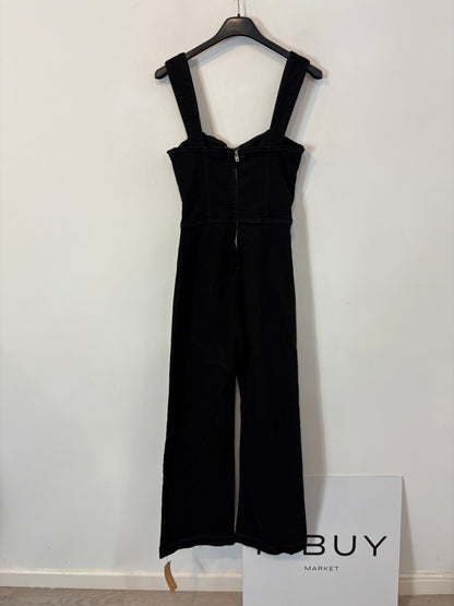 REFORMATION. Mono negro denim