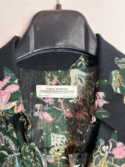 ZARA. Over a long, semi-sheer floral shirt. XS