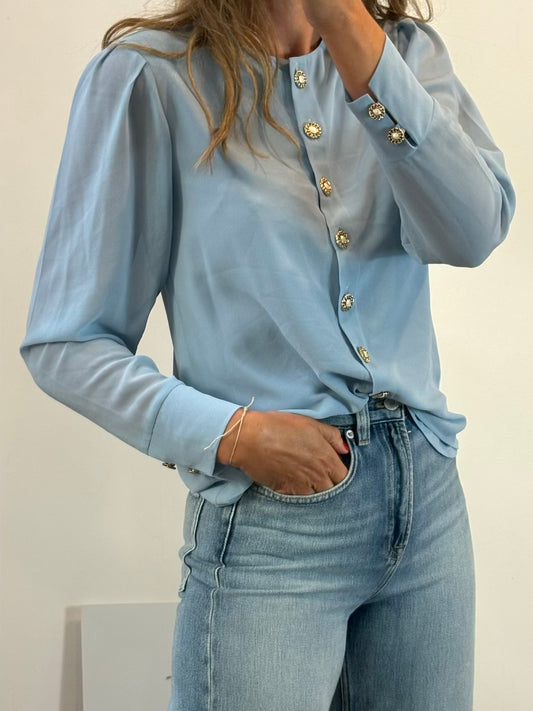 BIMANI. Blusa azul claro espalda abotonada