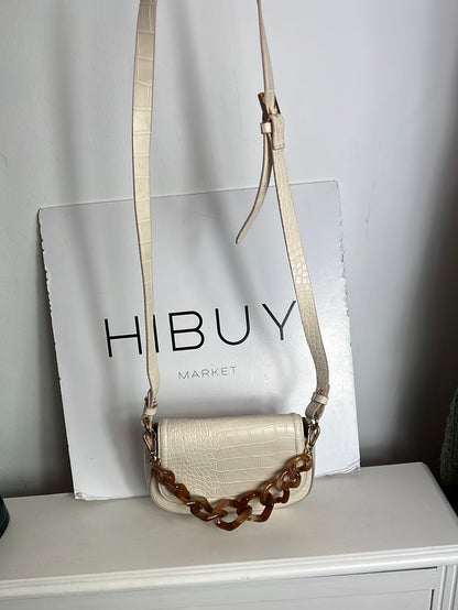 H&M. Bolso beige troquelado doble asa