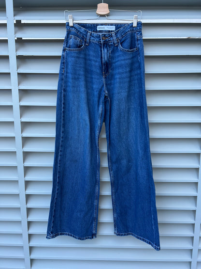 BERSHKA. Pantalón denim ancho