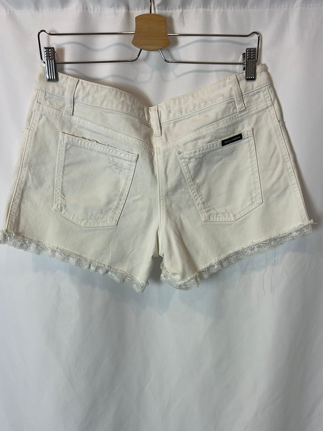 DOLCE&amp;GABBANA. White denim shorts with lace detail. Size 40
