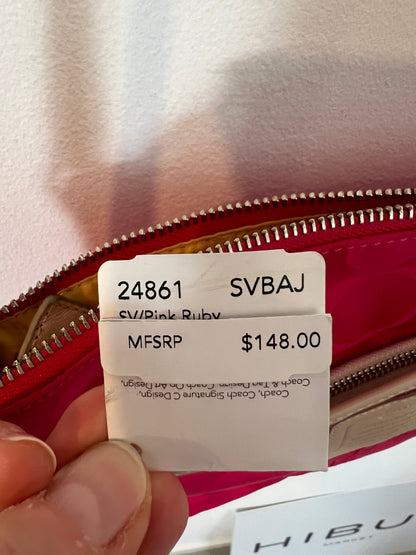 COACH. Bolso fucsia detalles en piel