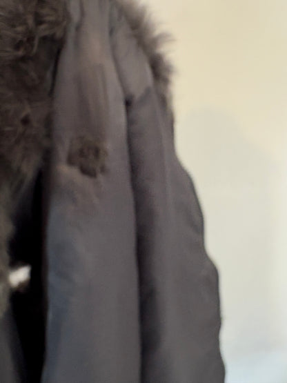 OTRAS. Chaleco pelo natural gris