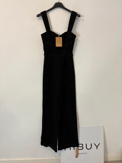 REFORMATION. Mono negro denim