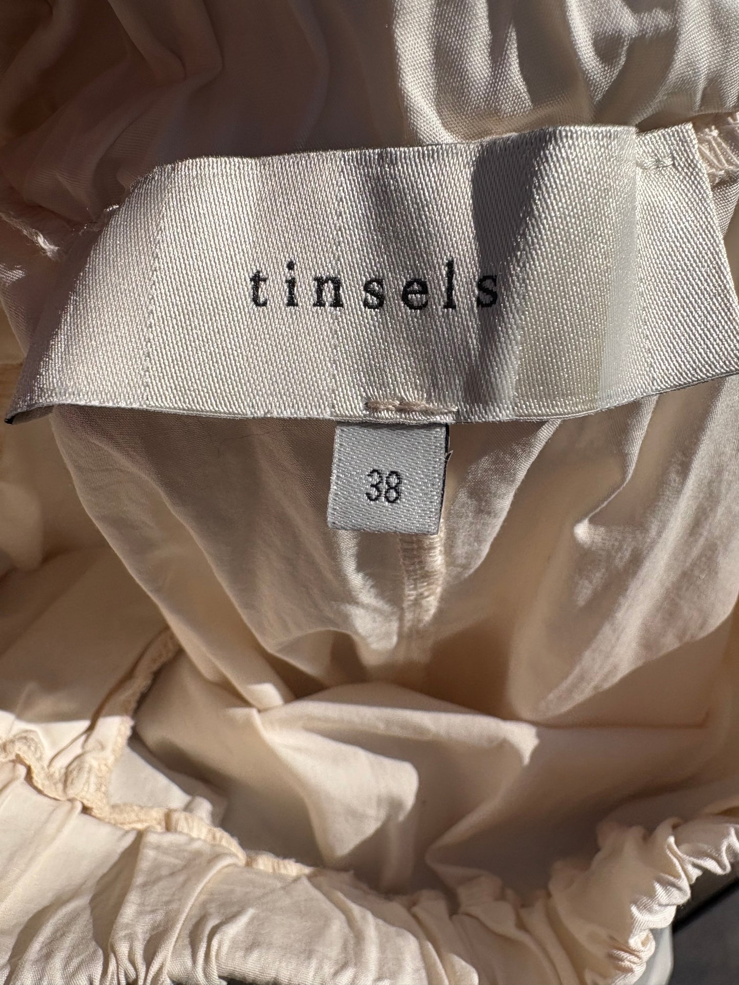TINSELS. Falda midi en crudo bolsillos