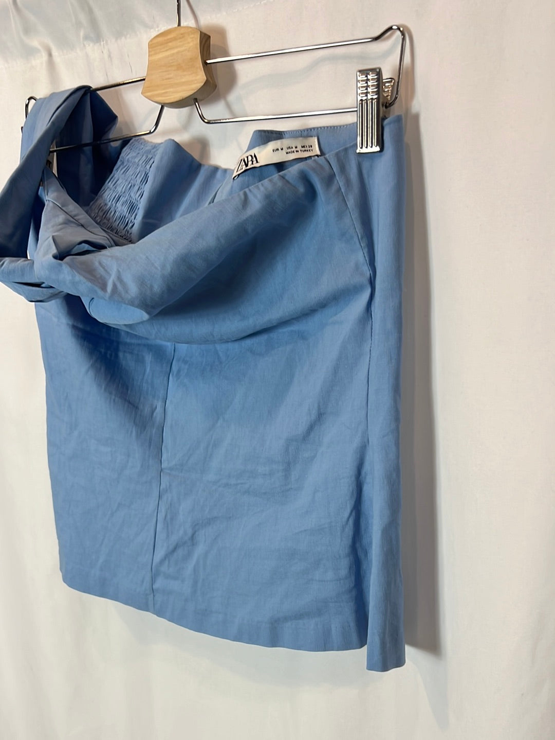 ZARA. Asymmetrical stretch blue top. TM