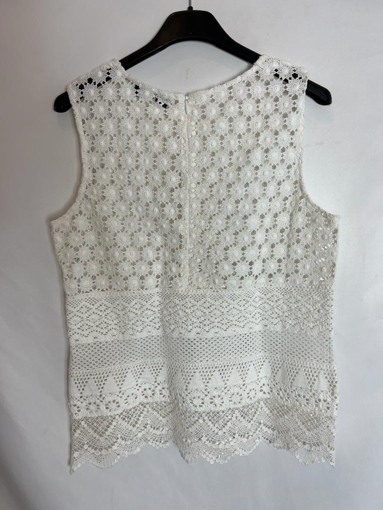 TBA. White die-cut top. Size XS