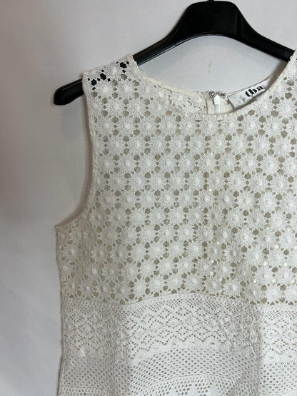 TBA. White die-cut top. Size XS
