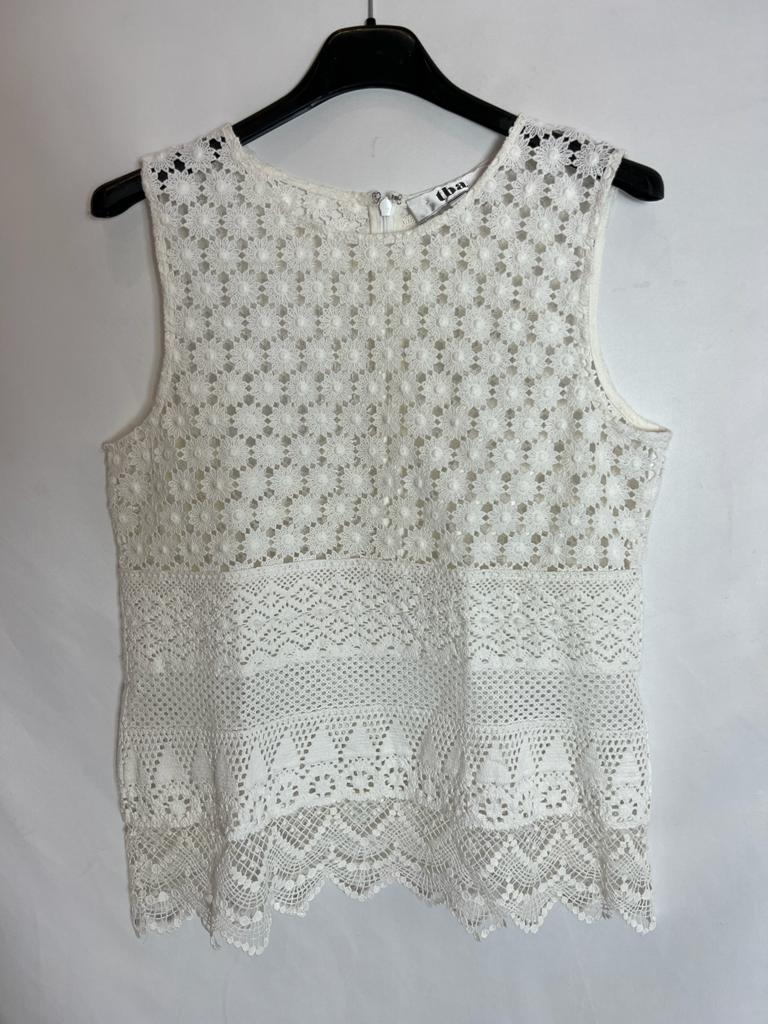 TBA. White die-cut top. Size XS