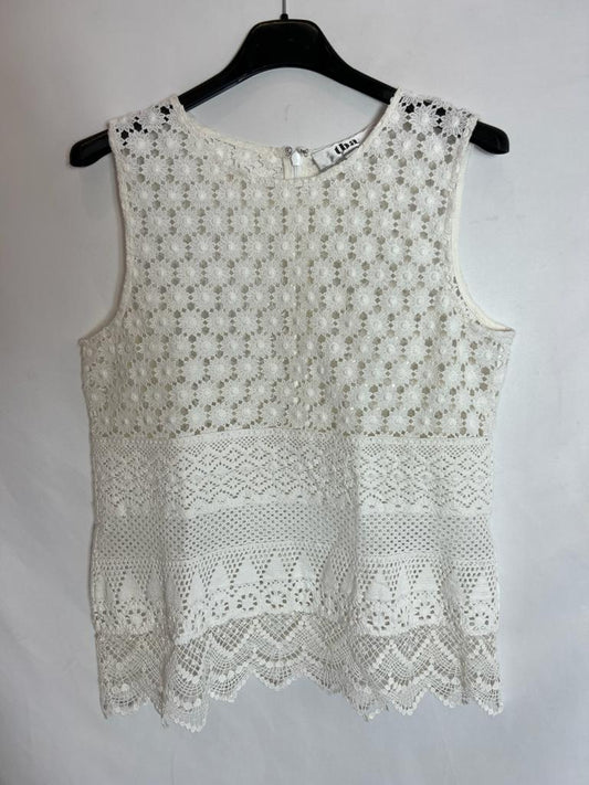 TBA. White die-cut top. Size XS