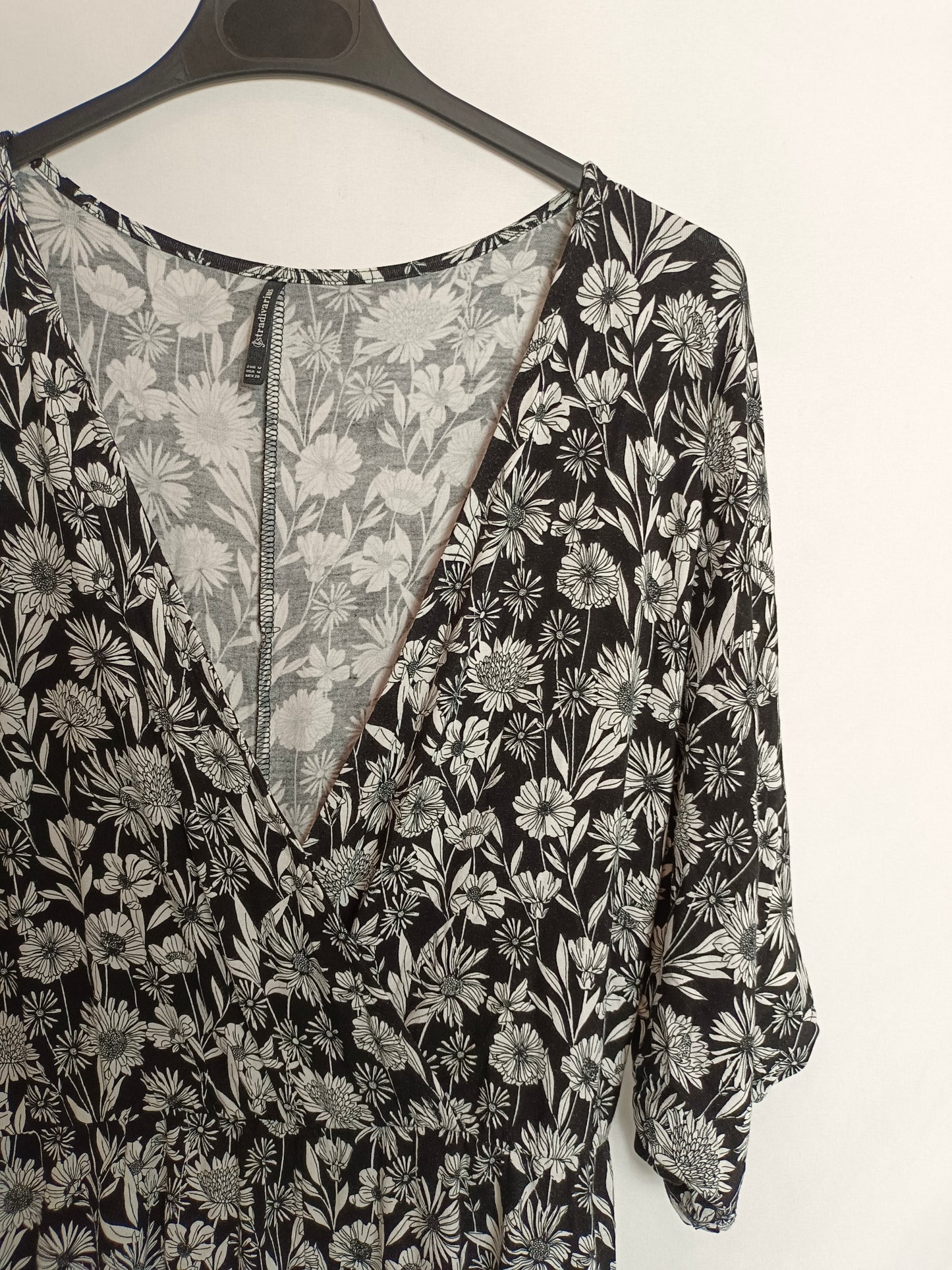 STRADIVARIUS. Black jumpsuit with white print.TM