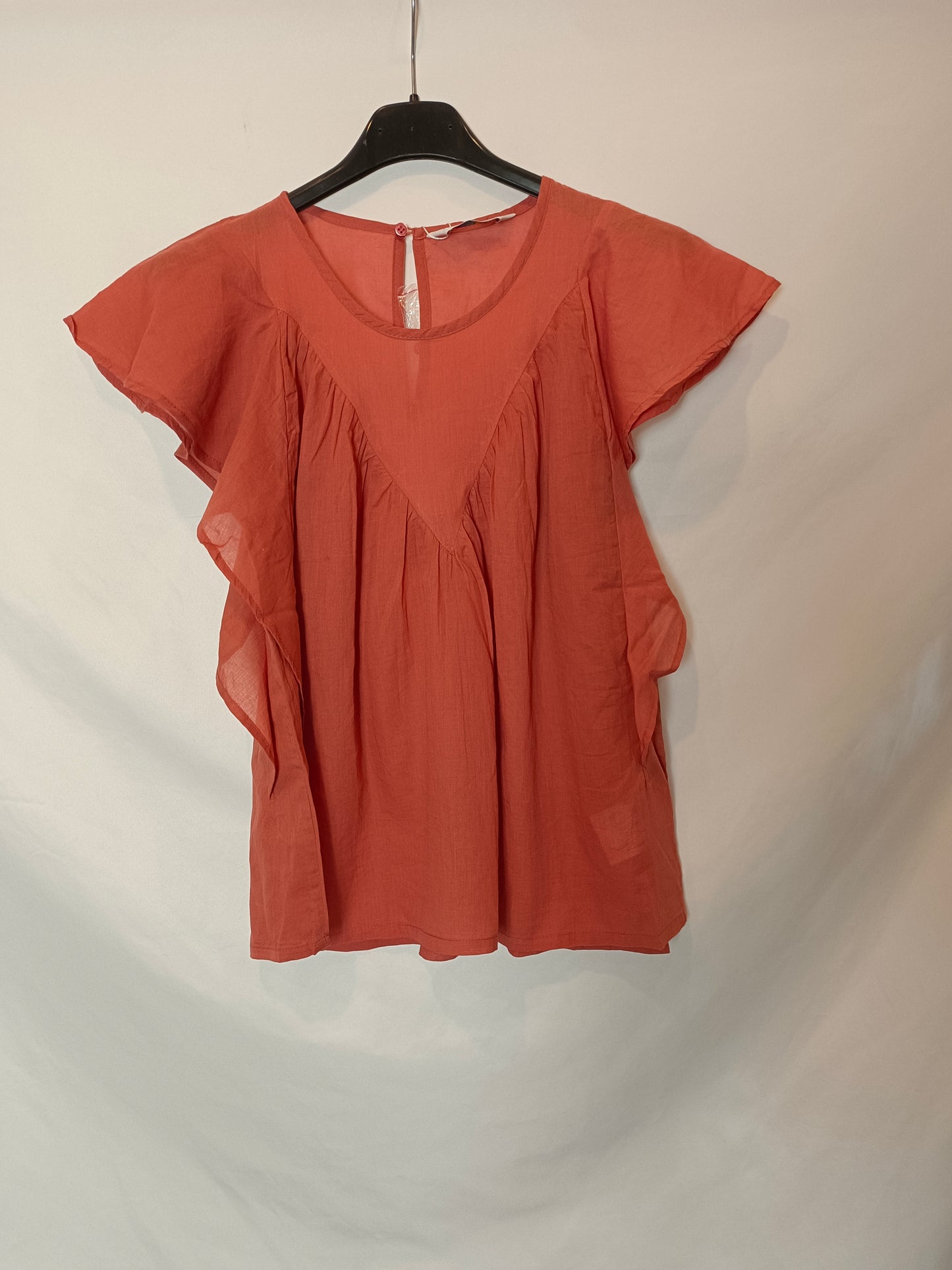 Fantastic company. Orange ruffled Ts blouse