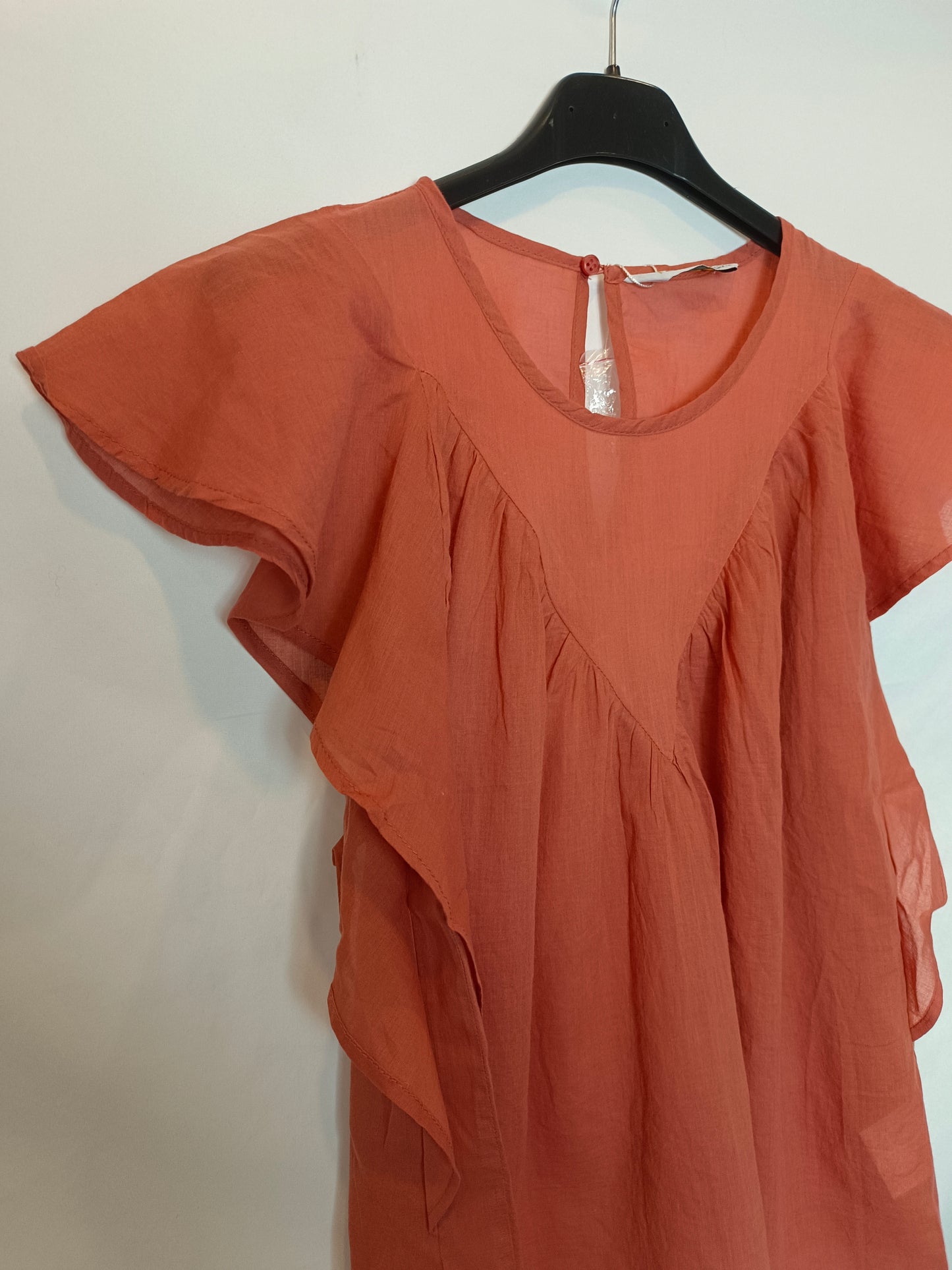 Fantastic company. Orange ruffled Ts blouse