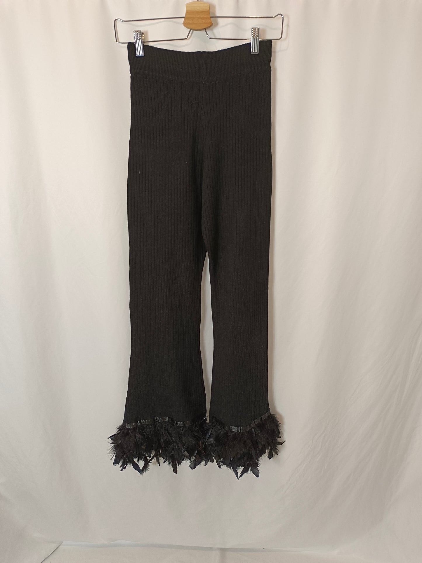 LUMINA. Black ribbed trousers with feathers Txs/s
