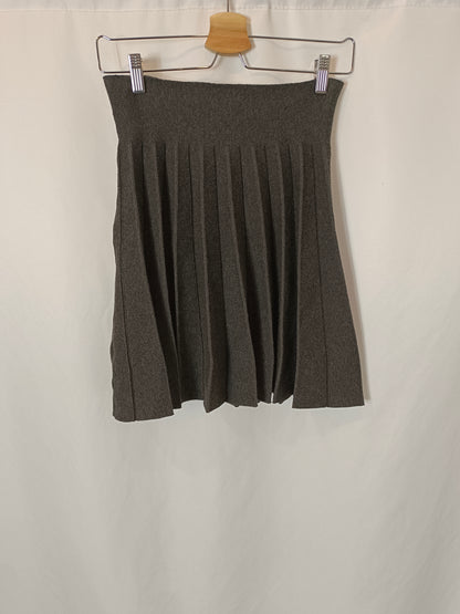 OTRAS. Falda gris punto tablas. T M