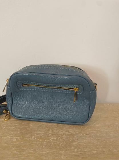 OTHERS. Blue leather bag with zippers