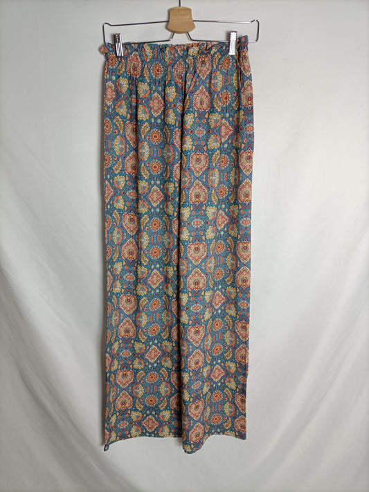 OTHERS. Flowing blue trousers with TU(S) print