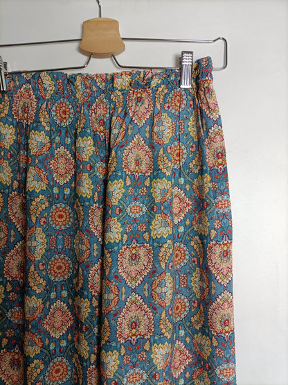 OTHERS. Flowing blue trousers with TU(S) print