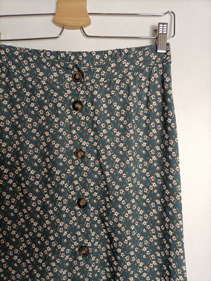 OTRAS. Falda gris florecitas T.u(m/l)