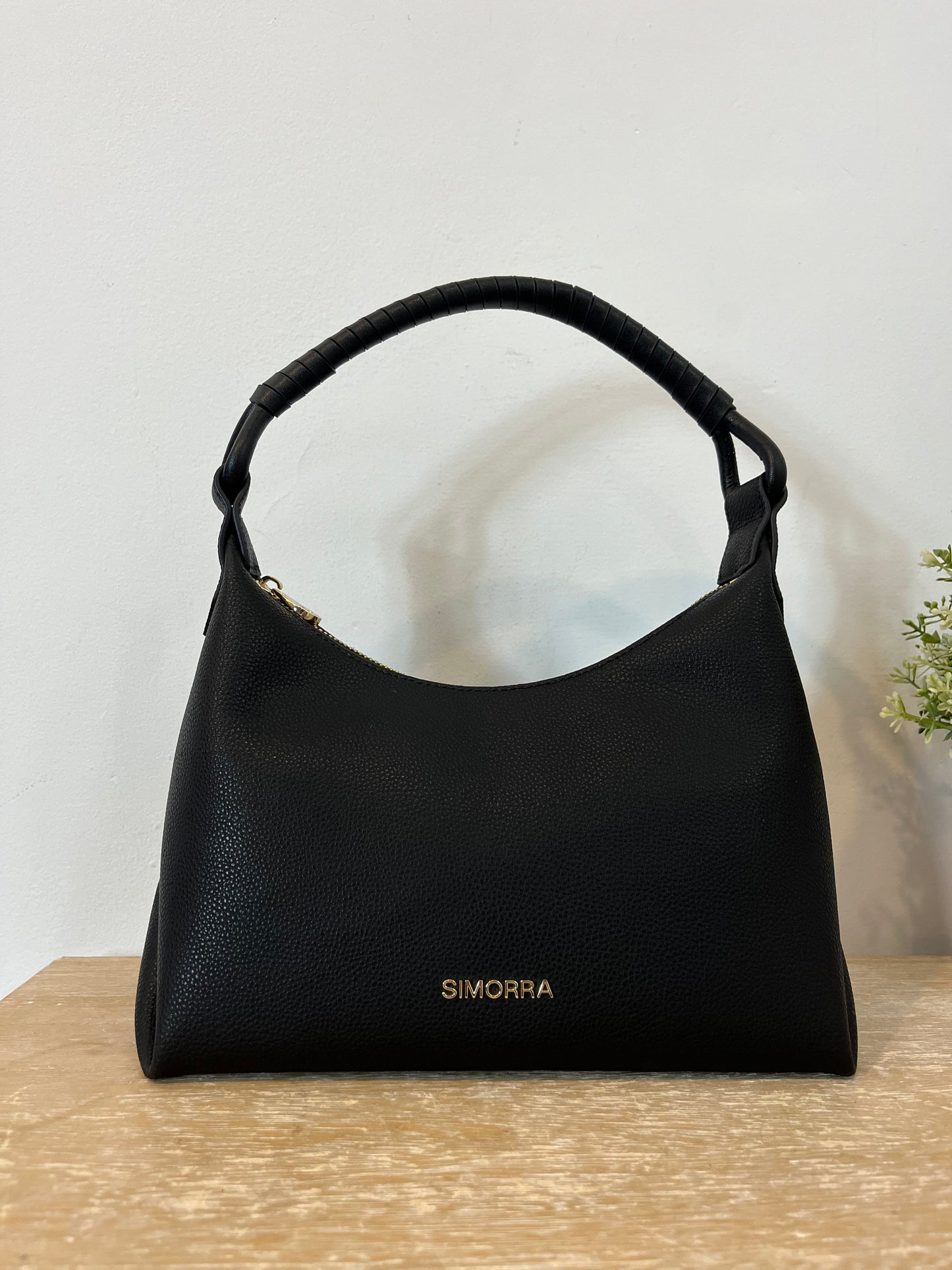 SIMORRA. Black leather bag