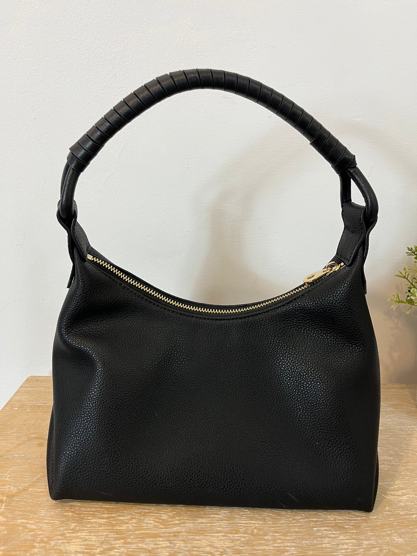 SIMORRA. Black leather bag