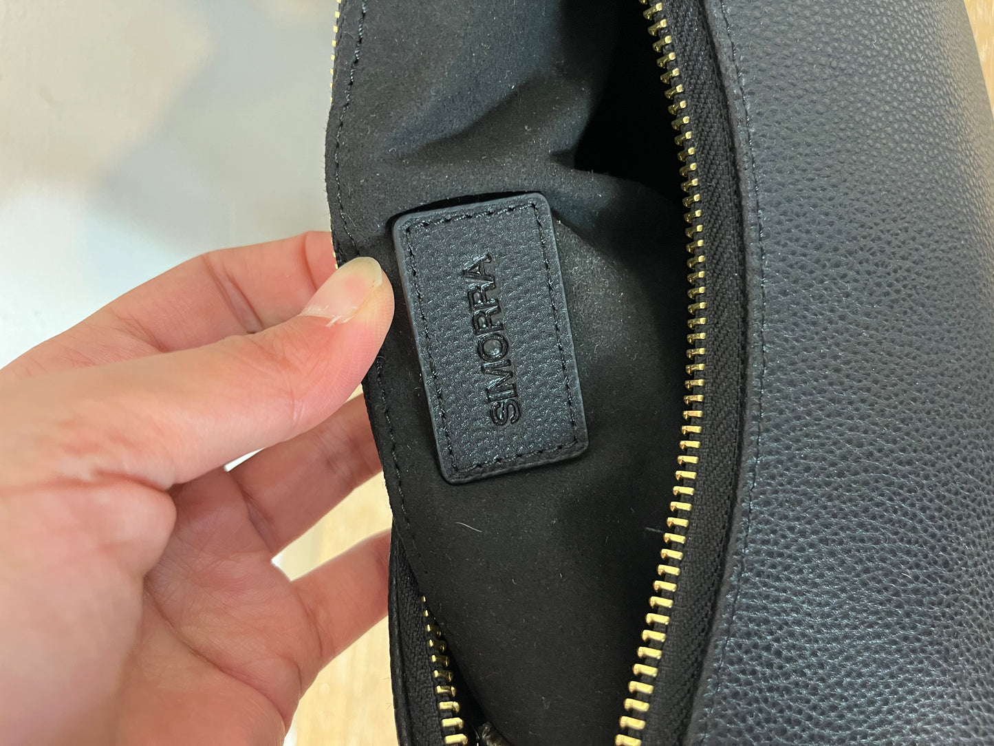 SIMORRA. Black leather bag