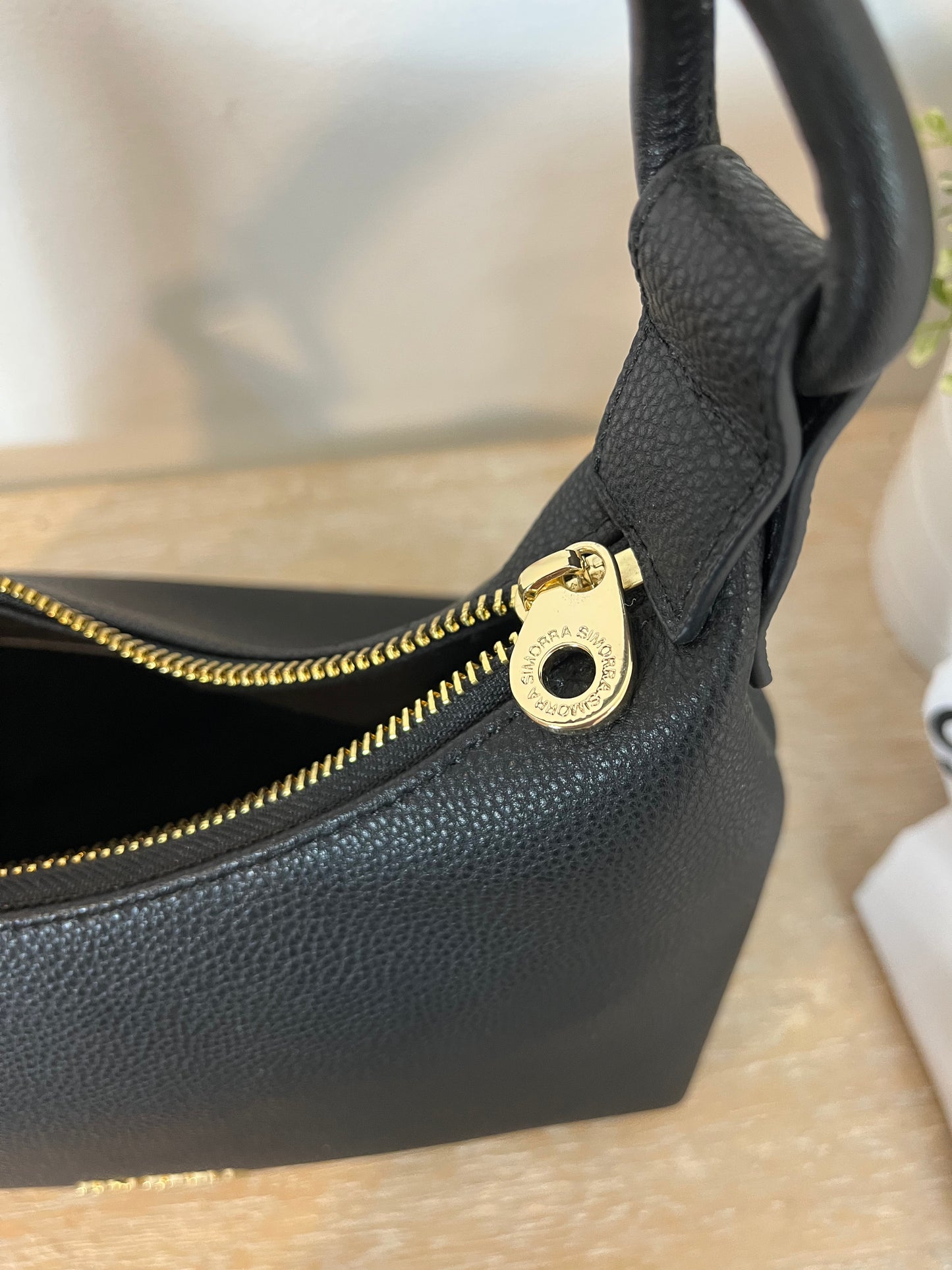 SIMORRA. Black leather bag