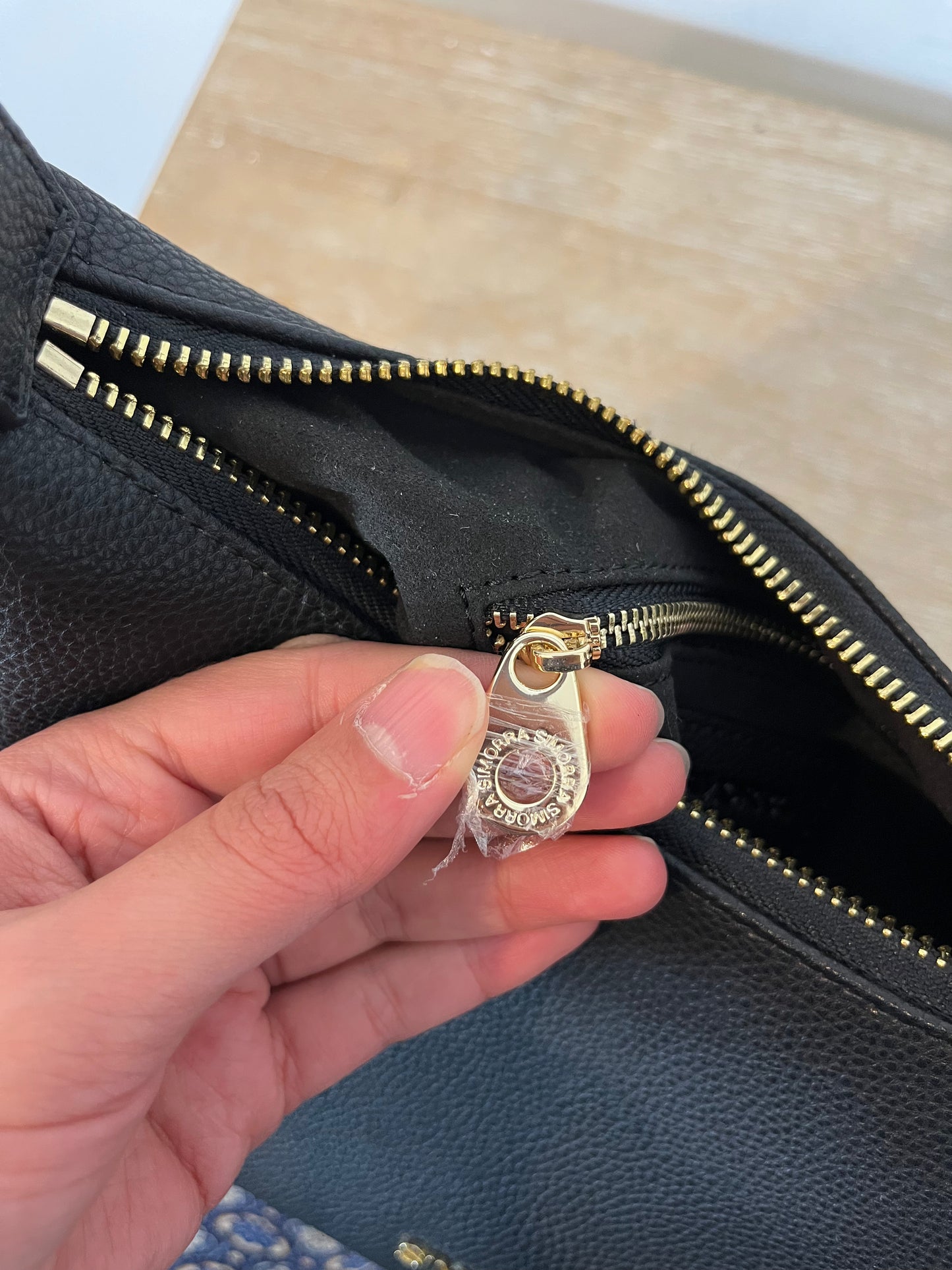 SIMORRA. Black leather bag