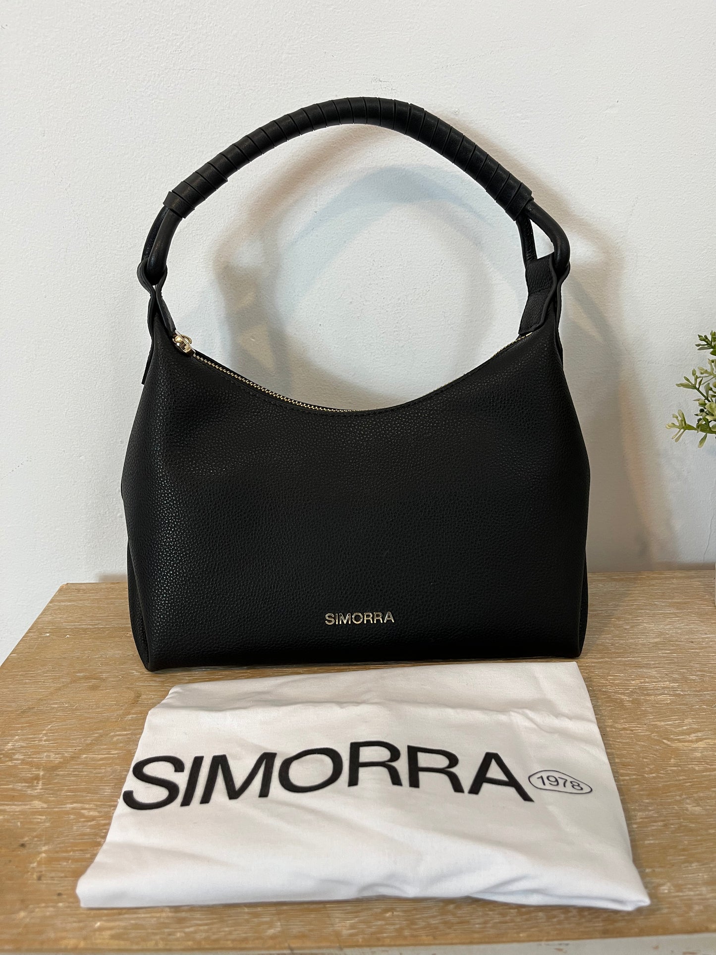 SIMORRA. Black leather bag
