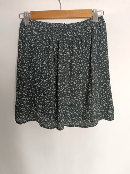 BROWNIE. Falda azul flores T.xs/s