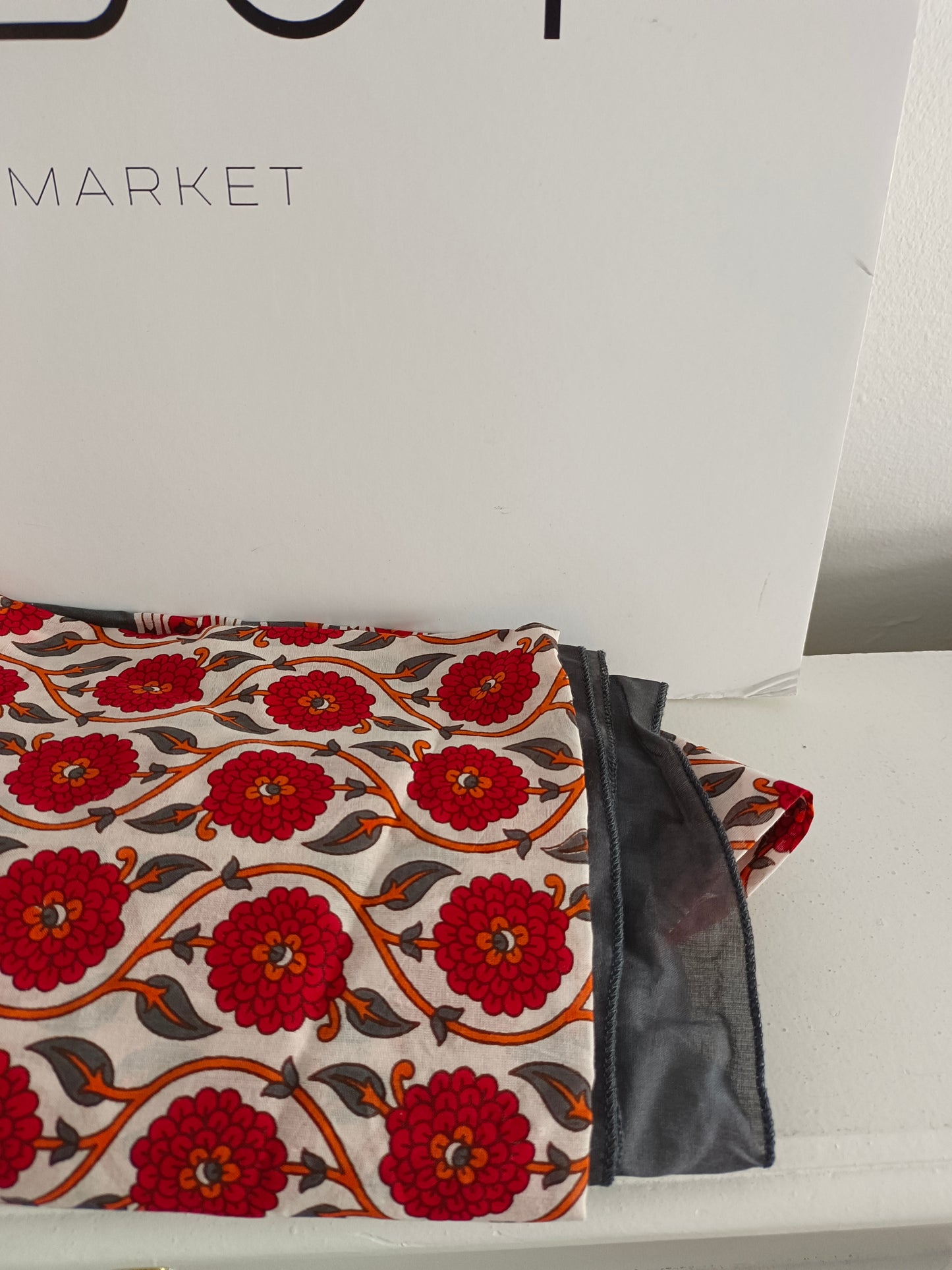 BOUGAINVILIA. White pareo with red flowers