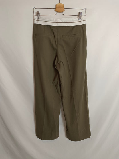 BERSHKA. Green pleated trousers, size 34