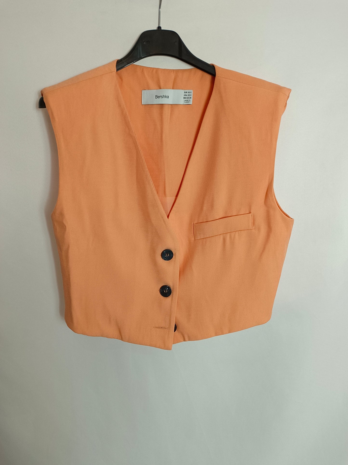BERSSHKA. Pale orange vest T.xs/s