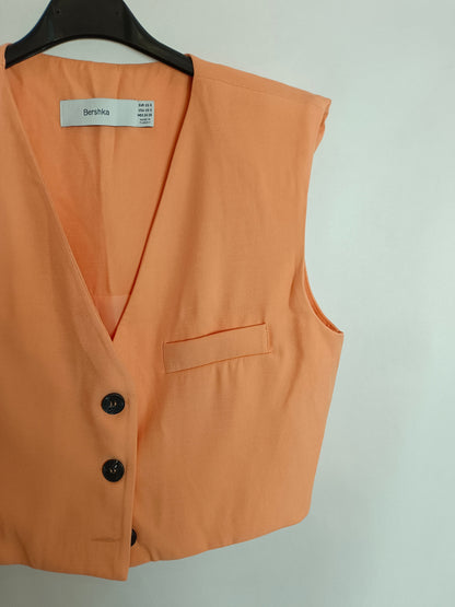 BERSSHKA. Pale orange vest T.xs/s