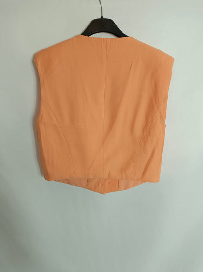 BERSSHKA. Pale orange vest T.xs/s