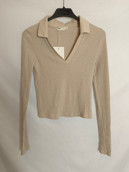 PULL&BEAR. Camiseta manqa larga estilo polo. T.S