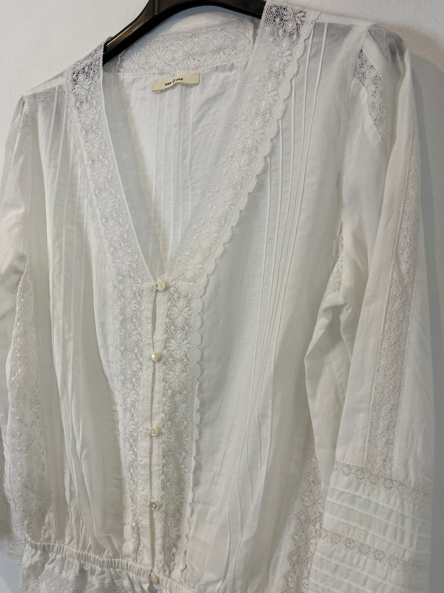 THAT ONE OR THAT ONE. White lace blouse. TS