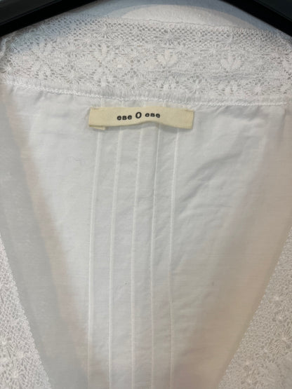 THAT ONE OR THAT ONE. White lace blouse. TS