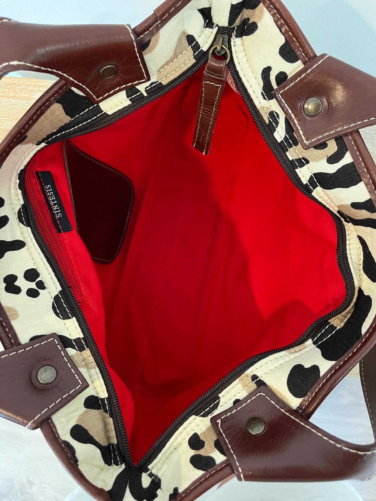 SYNTHESIS. Animal print bag with leather