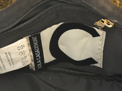 LOLA CASADEMUNT.  Bolso de mano dorado efecto piel