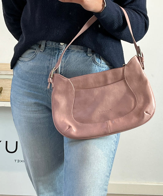 ACCENT. Bolso mediano rosa claro.