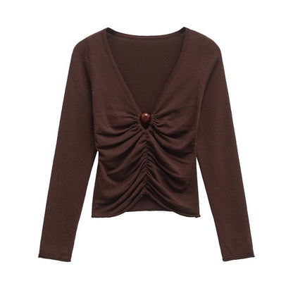 ZARA. Top marrón de manga larga con detalle abalorio