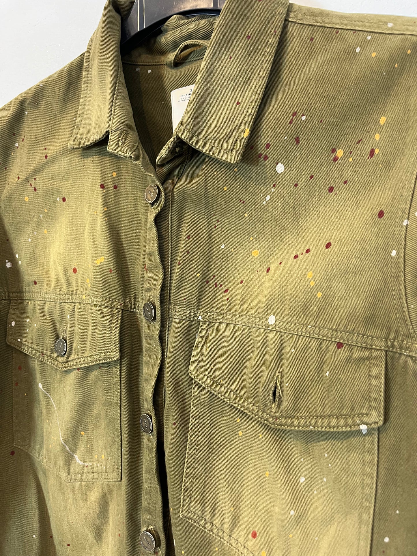 ZARA. On green shirt paint. T.S.