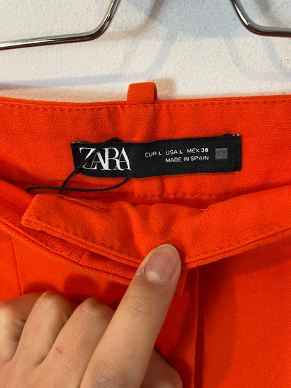 ZARA. Total look naranja chaleco y pantalón. T L/XL
