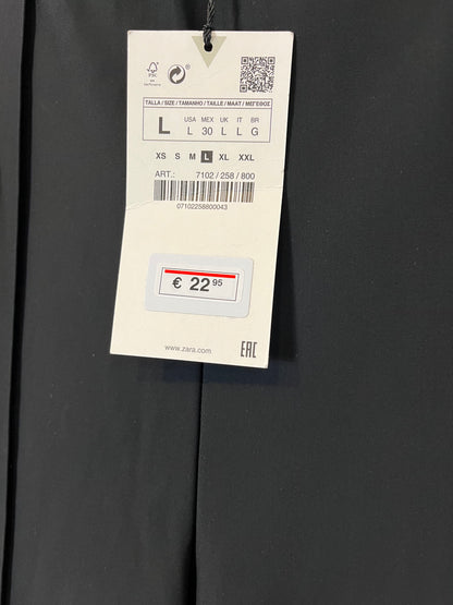 ZARA. Pantalón elástico costras con cremalleras . T L