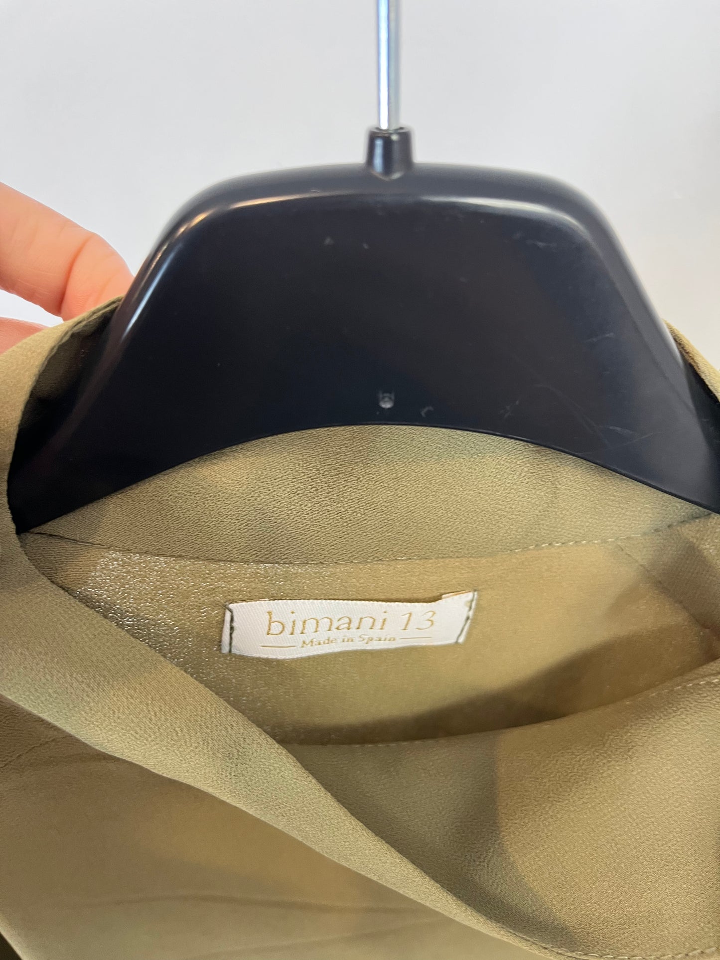 BIMANI. Flowing green blouse with a bow at the neck and gold buttons. Size XL