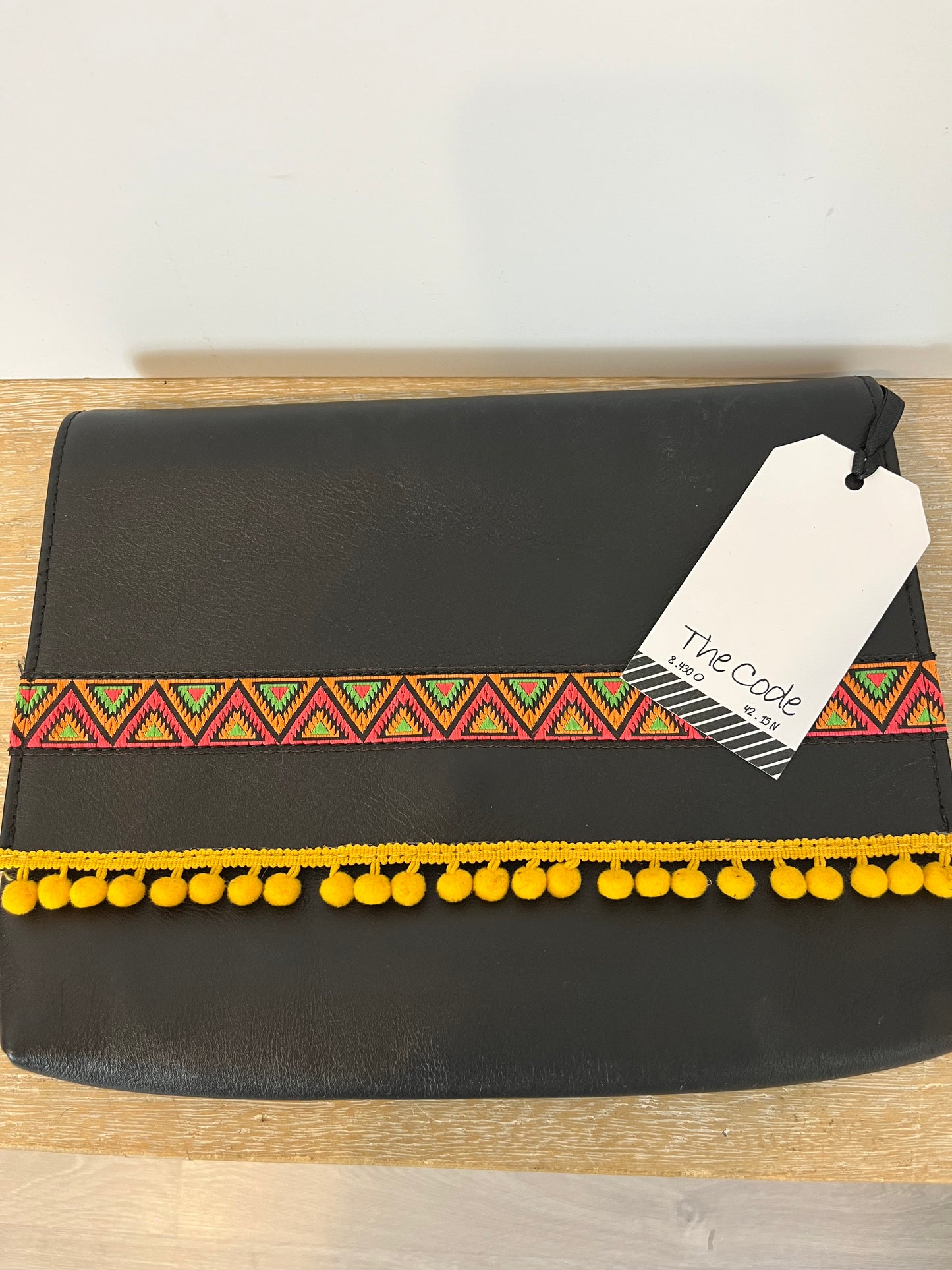 THE CODE. Black tassel clutch