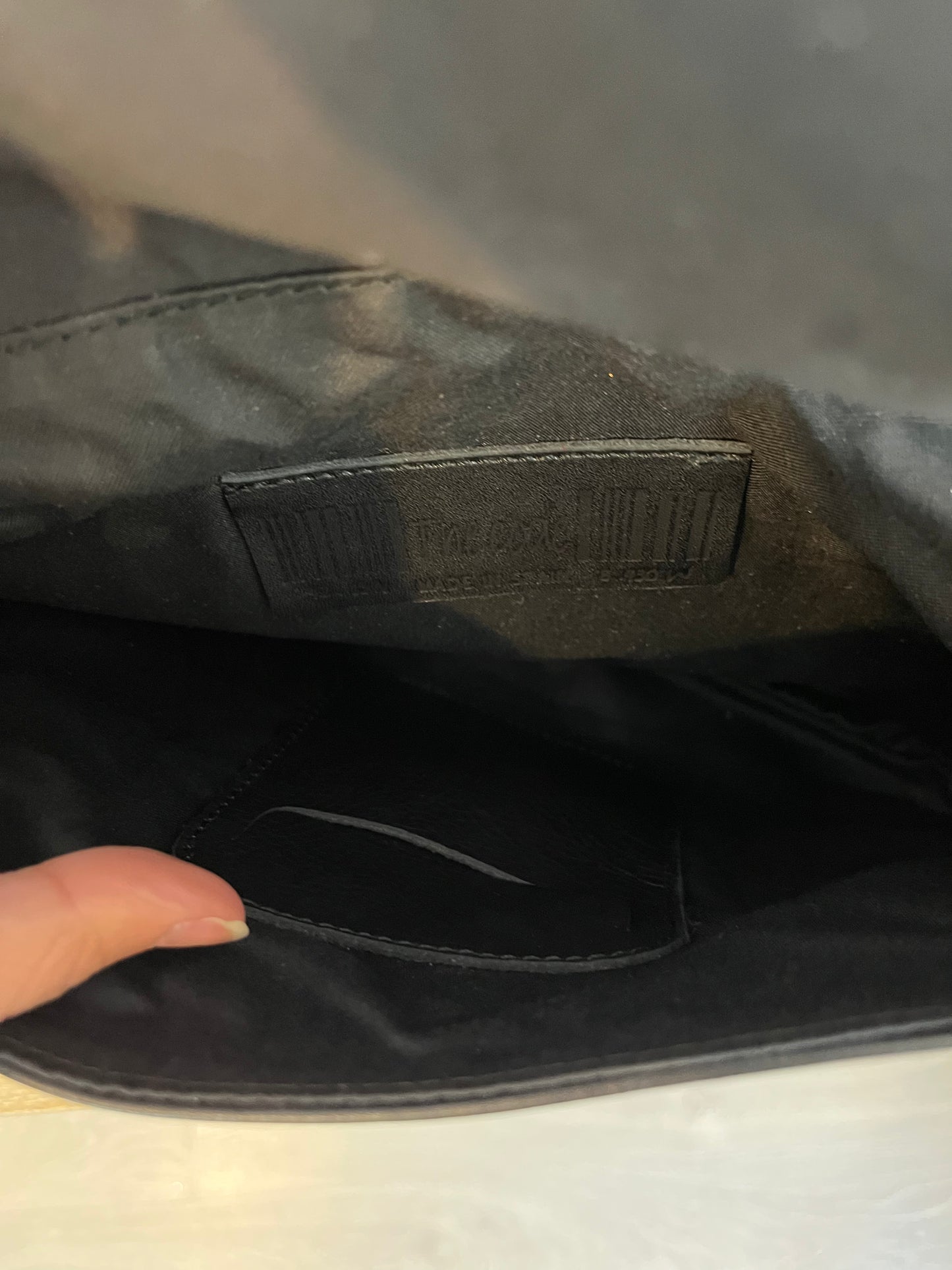 THE CODE. Black tassel clutch