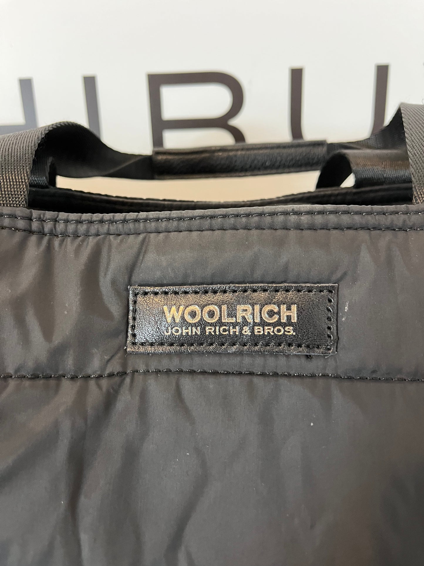 WOOLRICH. Semi-rigid quilted black bag